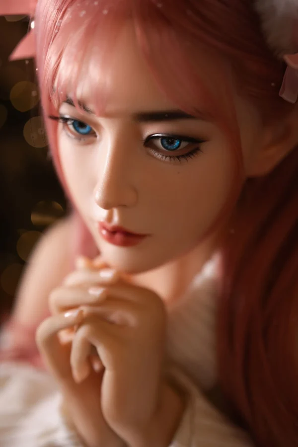 Close-up of Aiko doll Japanese face, soft pink hair, cute and alluring